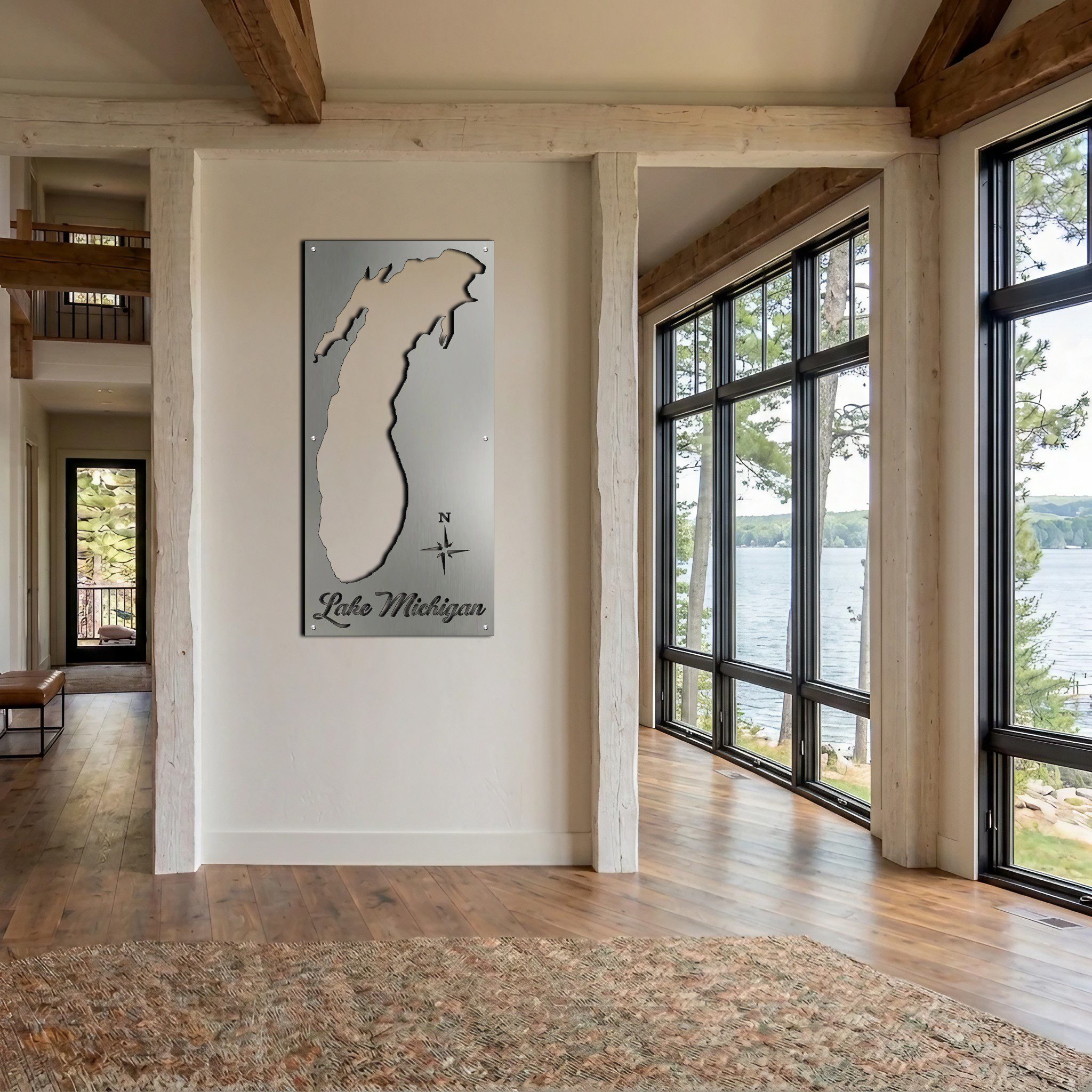 Metal map of Lake Michigan displayed on a wall in a bright, modern room with large windows.