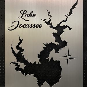 Lake Jocassee metal map with intricate cutout and compass rose on a perforated black background.