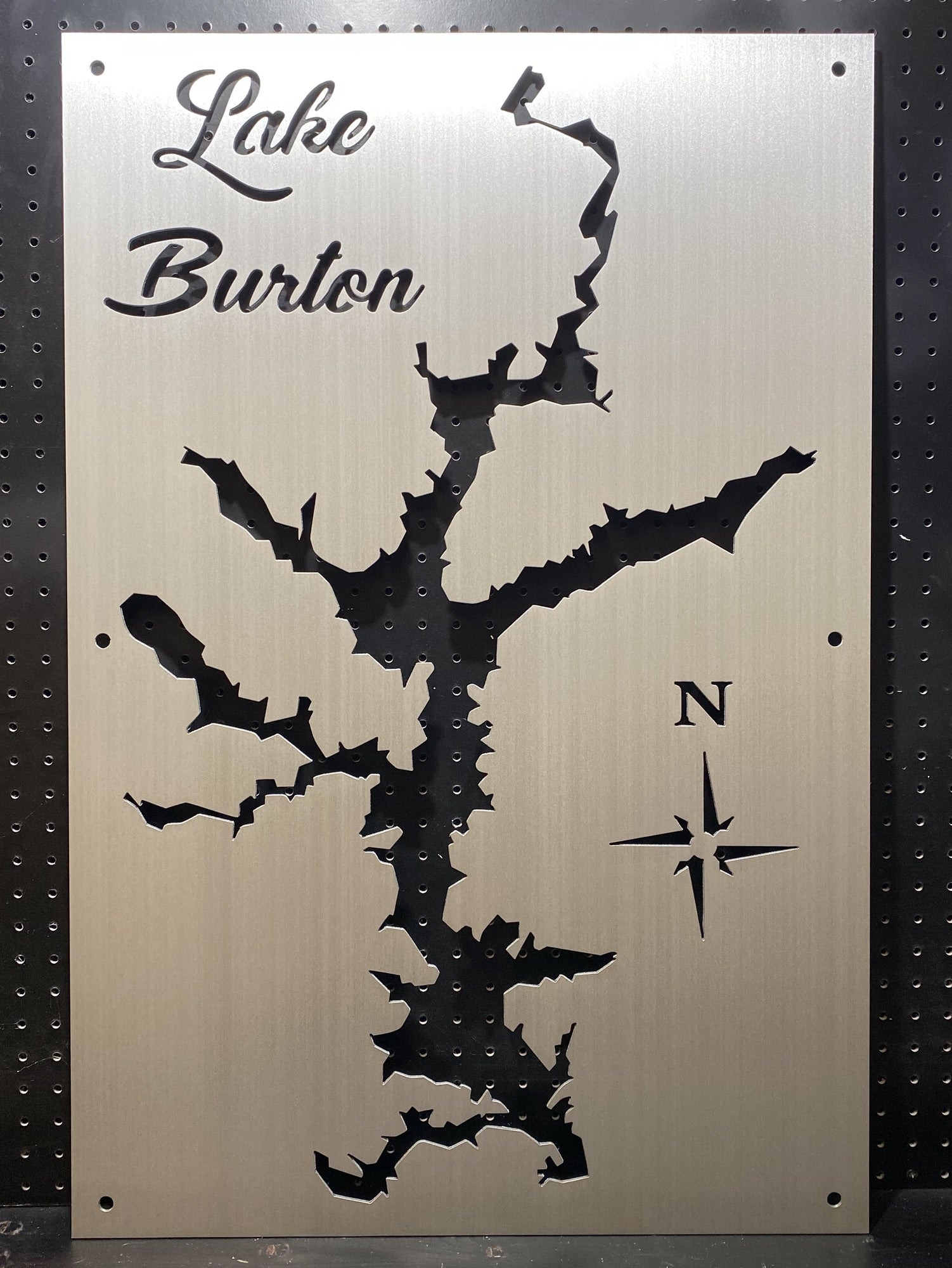 Lake Burton metal map cutout with decorative script and compass rose on brushed metallic background.