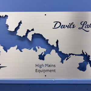 Metal map of Devils Lake with cut-out outline, featuring "High Plains Equipment" and a compass rose.