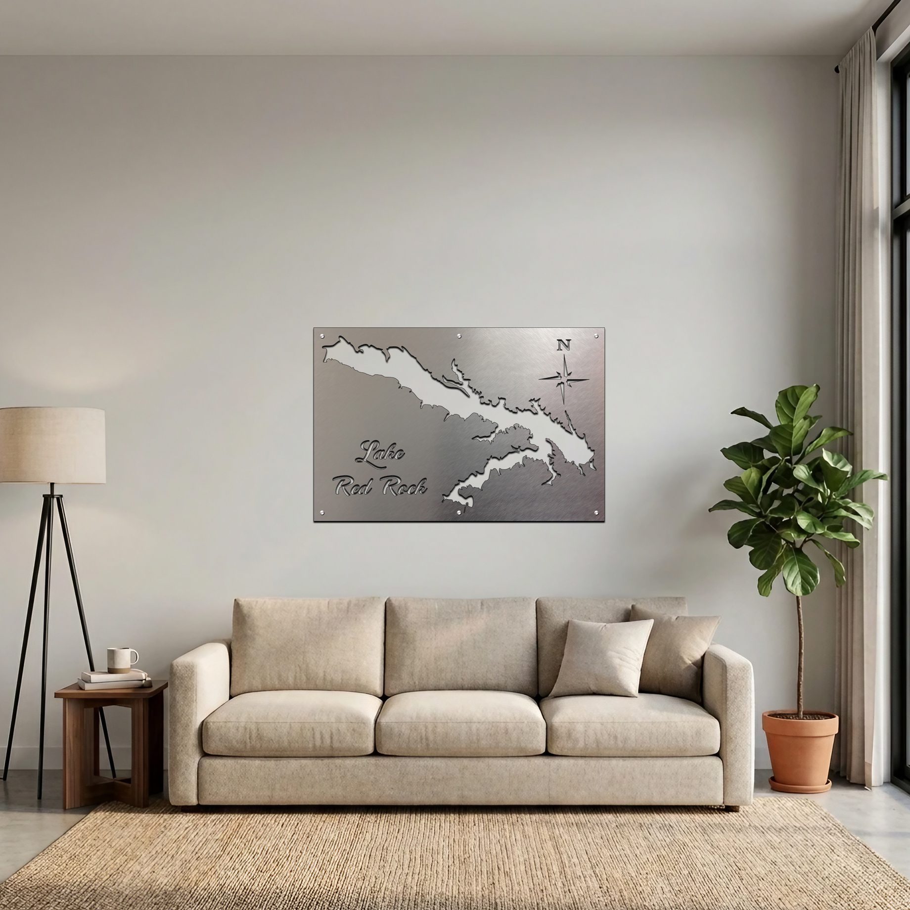 Metal map of Lake Red Rock displayed on a wall above a beige couch and a potted plant.