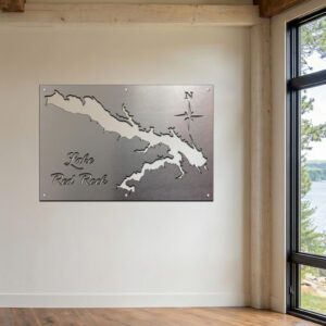Metal map of Lake Red Rock mounted on a wall, with a compass rose in the corner.
