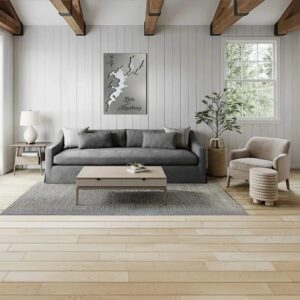 Modern living room featuring a gray sofa, coffee table, and a metal map of Lake Hopatcong on the wall.