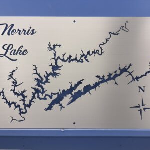 Metal map of Norris Lake with intricate shoreline details and a compass rose indicating north.