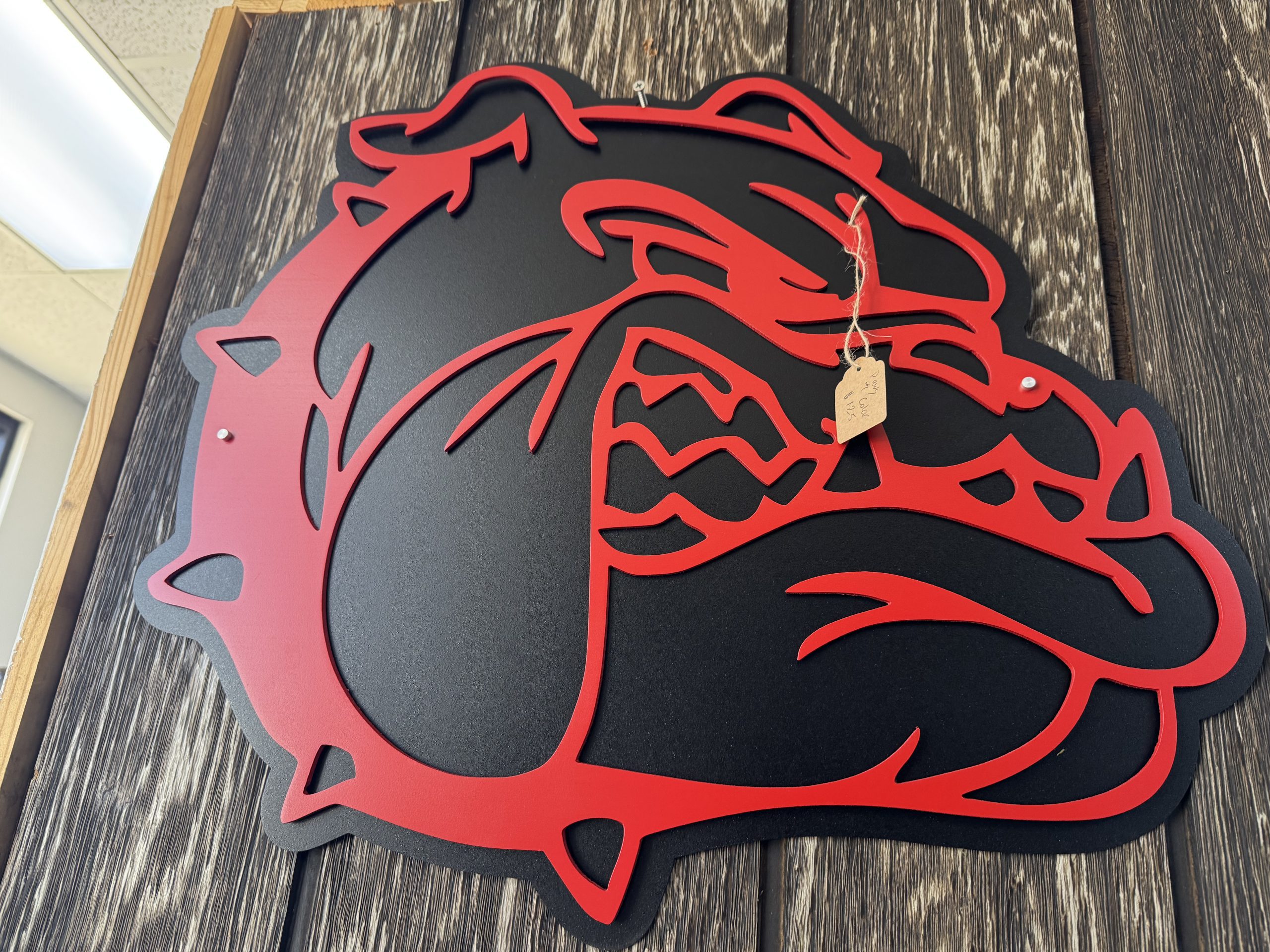 Custom layered red and black metal bulldog sign.