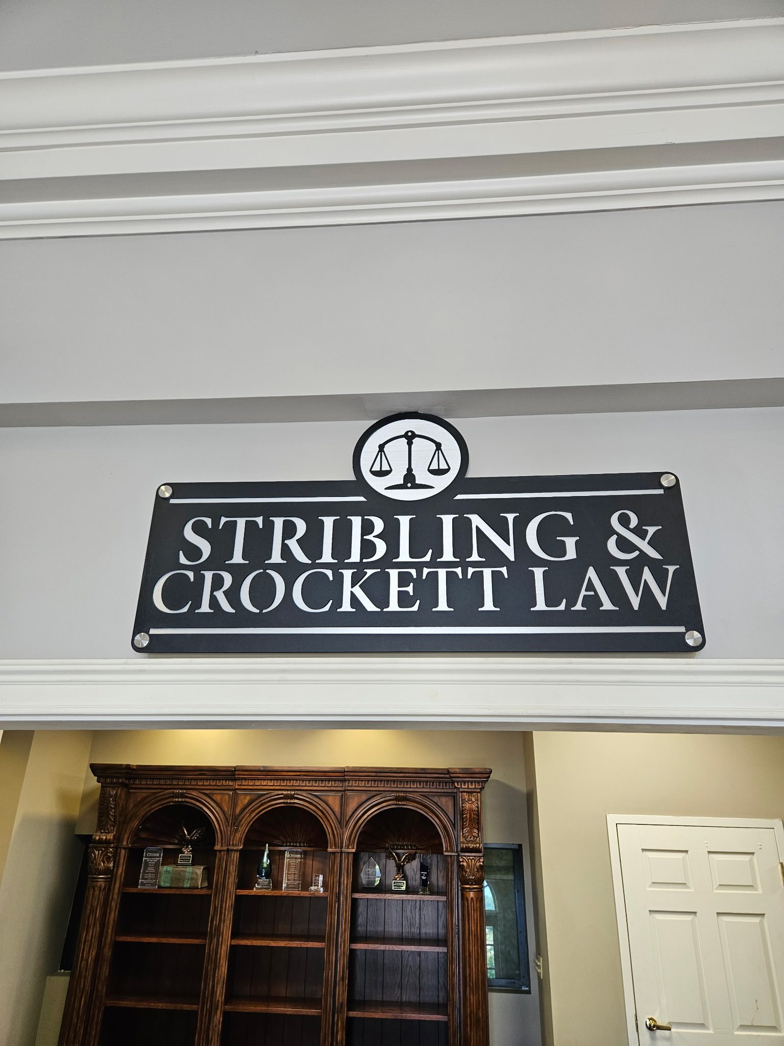 Custom metal business sign for Stribling and Crockett Law.