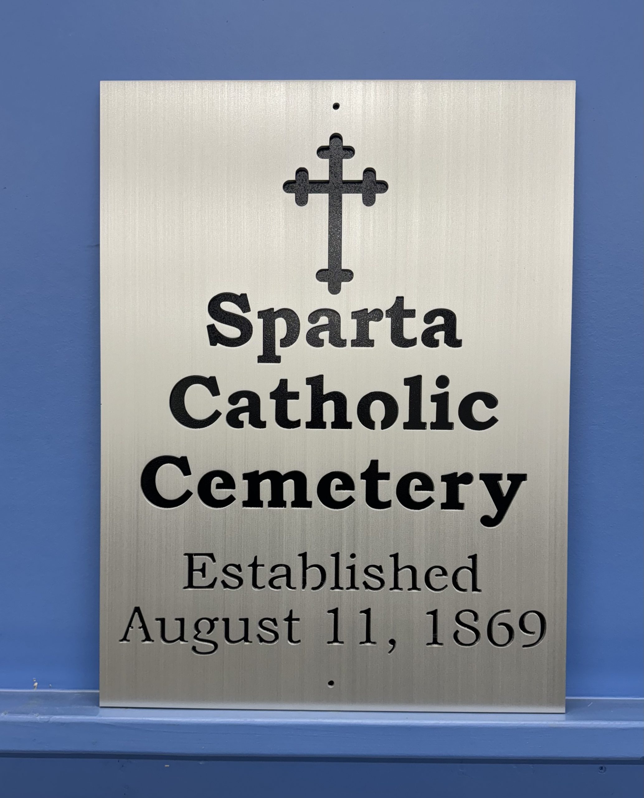 Custom brushed metal sign for Sparta Catholic Cemetery.