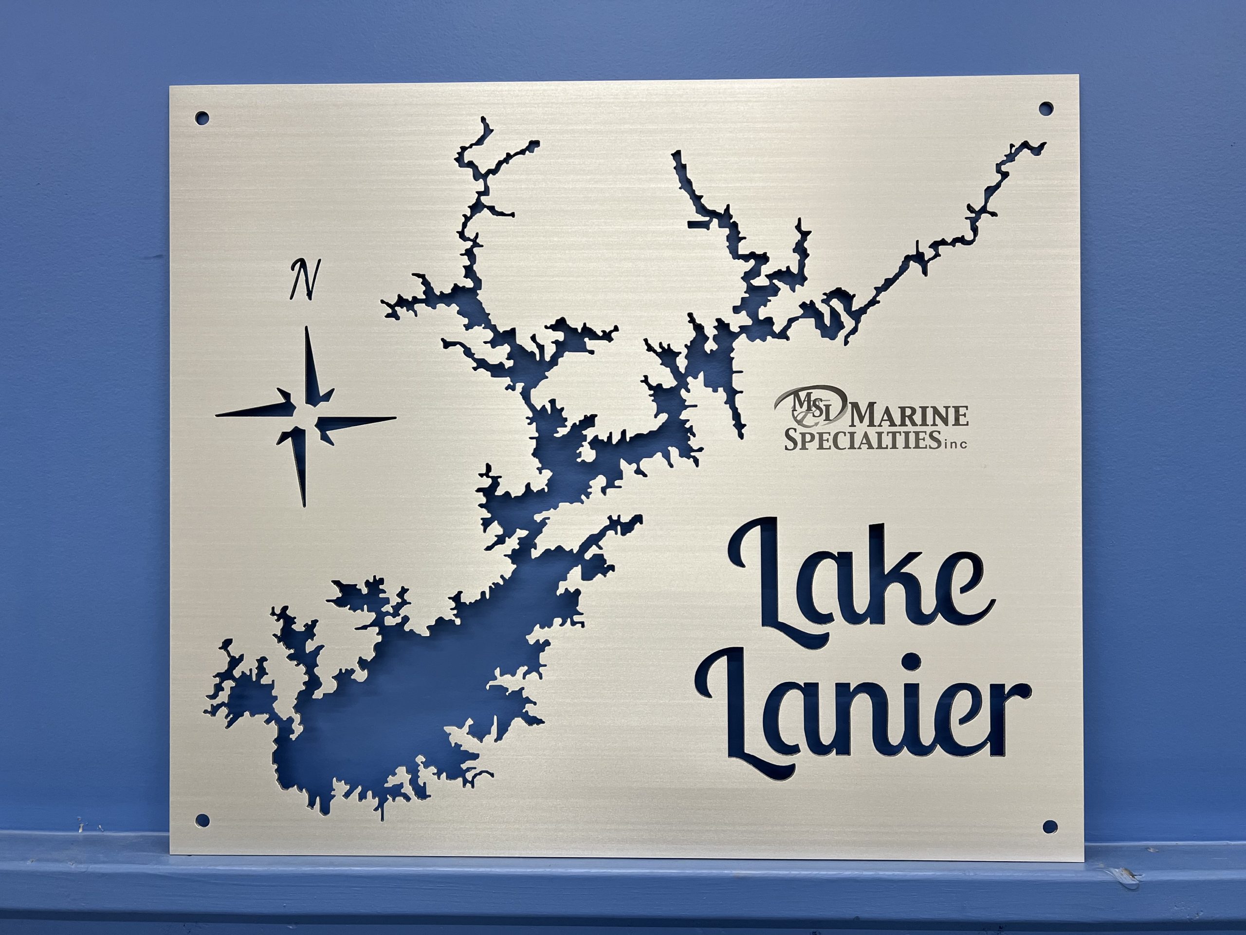 Personalized Lake Lanier metal map with the Marine Specialties logo and open shoreline cutouts.