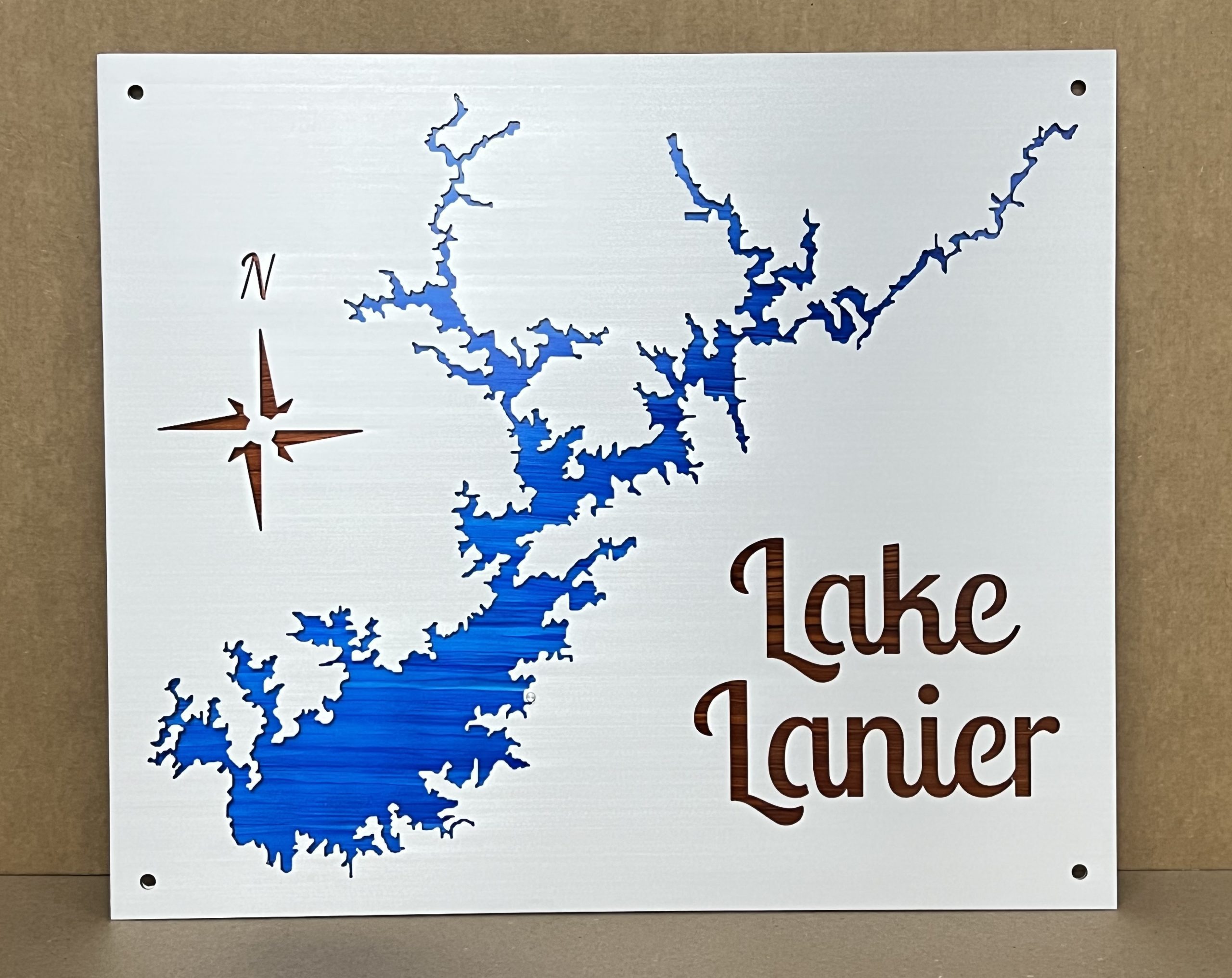 Lake Lanier metal map with a blue full-color backplate and contrasting compass and lettering.