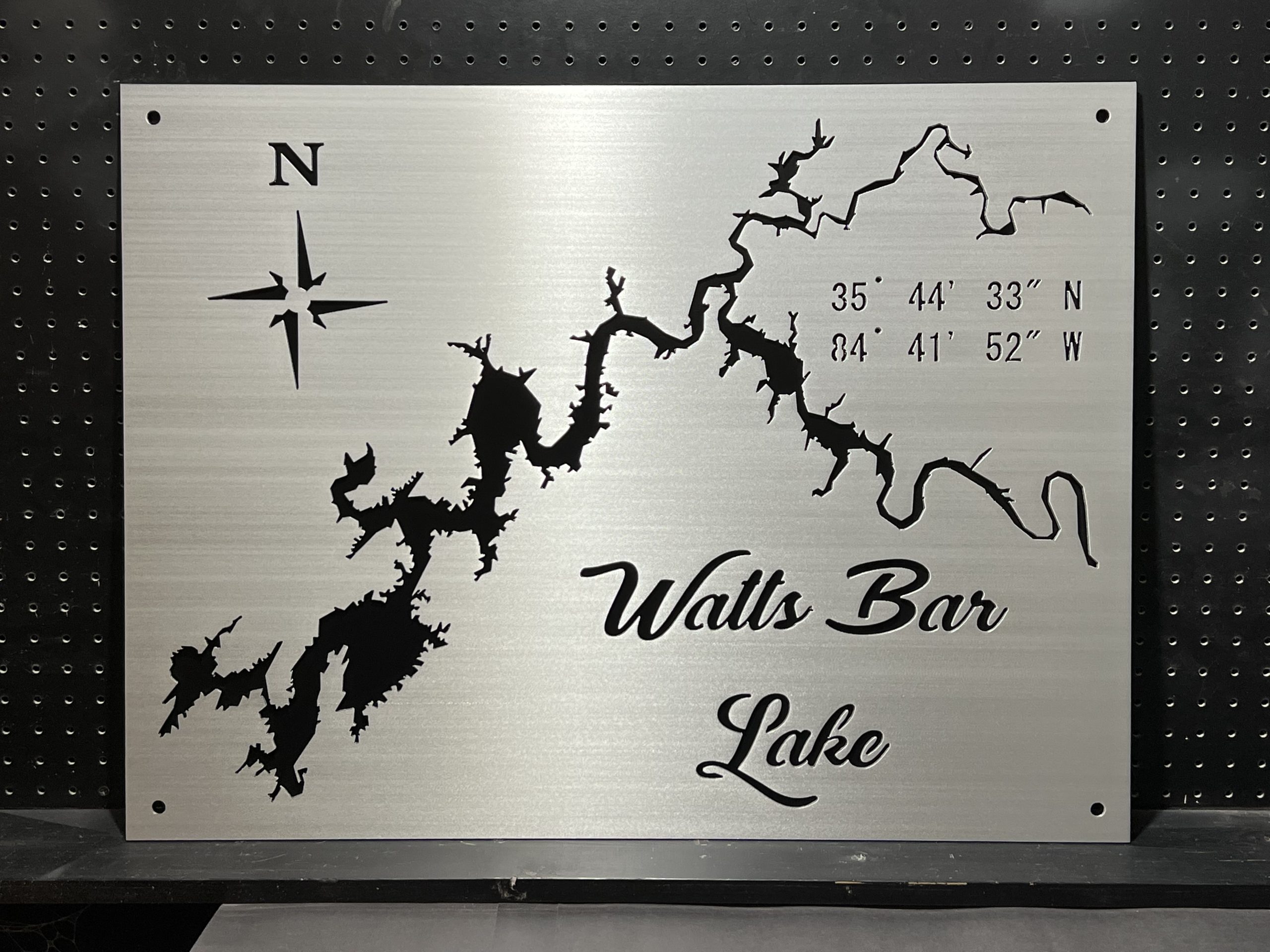 Watts Bar Lake brushed metal map personalized with coordinates and a solid black backplate.